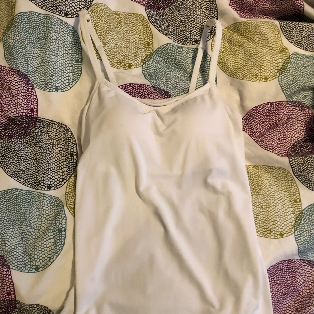 White Uniqlo tank top.